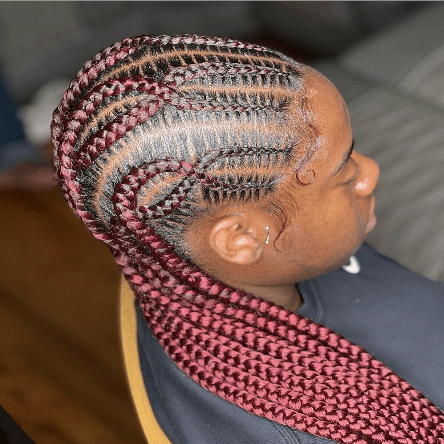 crossed maroon braids 